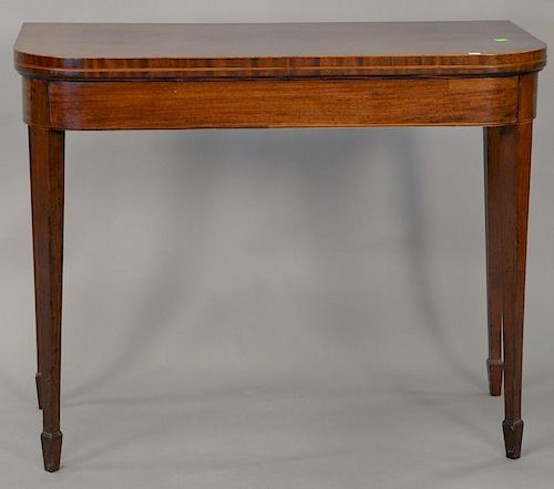 George III mahogany game table with felt interior, circa 1800. ht. 29 1/2in., wd. 37in.