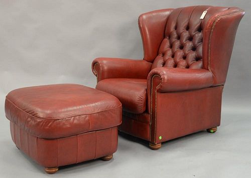 Natuzzi red leather chair and ottoman.