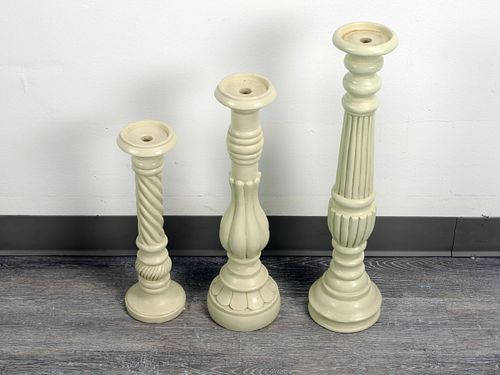 THREE PILLAR CANDLE HOLDERS OF VARYING HEIGHT