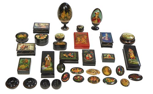 Group of Thirty-Seven Russian Hand Painted Lacquered Items, 20th c., consisting of twelve rectangular covered boxes, ten brooches, two eggs on stands,