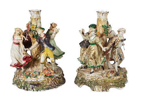 Pair of German Porcelain Figural Vases, 20th c., by Von Schierholz, with dancing 19th c. costumed couples around a tree form vase with relief flowers,