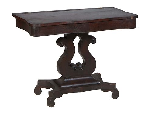 American Classical Carved Mahogany Side Table, 19th c. The serpentine top on a pierced lyre form support to a sloping socle quadruped base, H.- 27 1/2