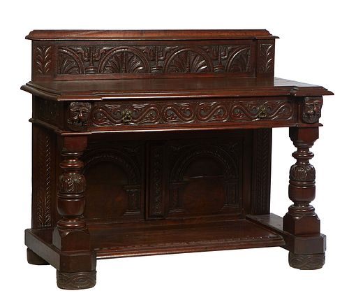 Continental Carved Oak Server, 19th c., the thick stepped leaf carved back over a stepped breakfront top with a large center frieze drawer, on Jacobea