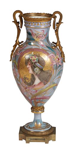 Sevres Style Bronze Mounted Baluster Porcelain Vase, 20th c., in pale blue with gilt and floral decoration, and bronze handles flanking a reserve of a