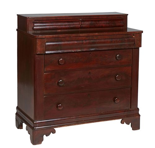 American Classical Carved Mahogany Chest, 19th c., the top with two setback glove drawers on a base with a cavetto frieze drawer, over three graduated