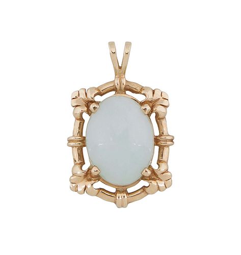 14K Yellow Gold Jade Pendant, with a cabochon white jade oval stone, within a pierced oval leaf mounted frame, H.- 1 3/16 in., W.- 3/4 in. Provenance: