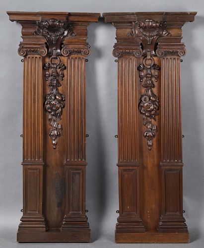 Pair of Victorian Carved Walnut Architectural Elements, 19th c., the breakfront stepped crown over a shield flanked by engaged Ionic tapered fluted co