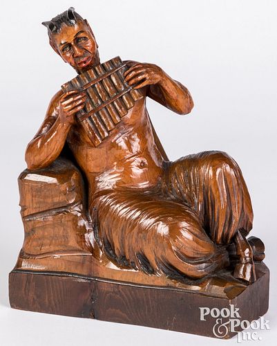 Pan whistler, carved and stained wood figure