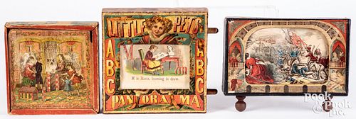 Three lithographed paper on wood toys