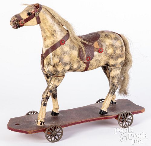 Dabbled painted and carved wood platform horse
