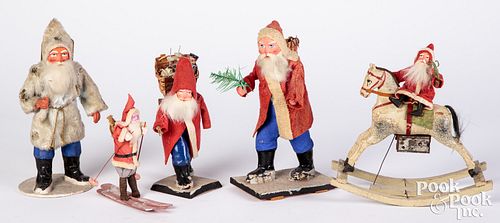 Five Santa figures