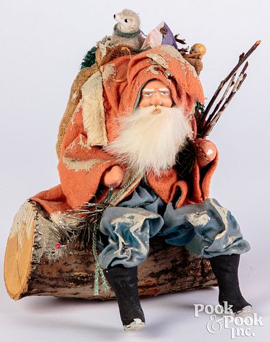 Santa seated on log figure