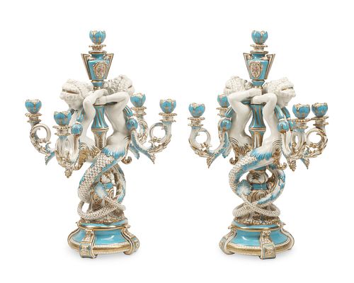 A pair of French Sevres-style porcelain candelabra