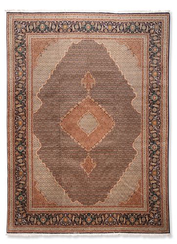 A Persian Tabriz area rug