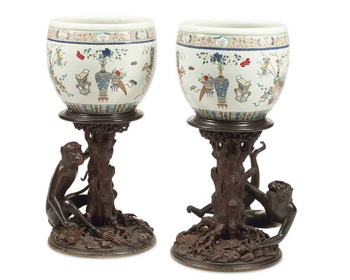 A pair of Chinese ceramic fish bowls on stands
