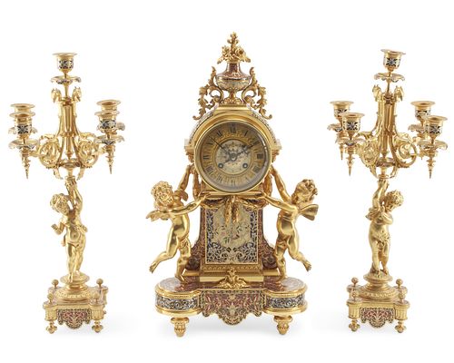 A French gilt-bronze and champleve mantle clock set