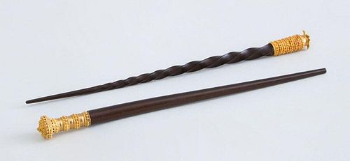 TWO GOLD-MOUNTED EBONY HAIR PINS, POSSIBLY GOLD COAST