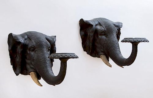 PAIR OF ANGLO-INDIAN CARVED AND PAINTED WOOD ELEPHANT HEAD WALL BRACKETS