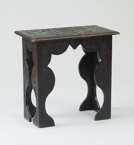 SPANISH COLONIAL CARVED EBONIZED SIDE TABLE