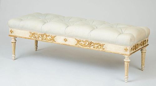 LOUIS PHILIPPE CREAM-PAINTED AND PARCEL-GILT WINDOW BENCH
