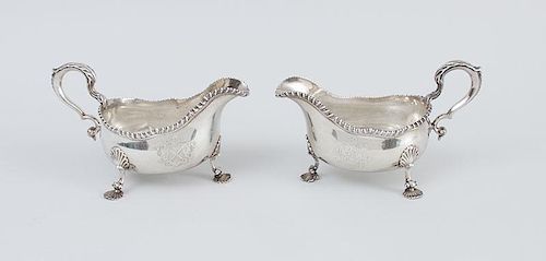 PAIR OF EARLY GEORGE III ARMORIAL SILVER TRIPOD SAUCE BOATS, OF AMERICAN INTEREST, WITH LATER INSCRIPTIONS