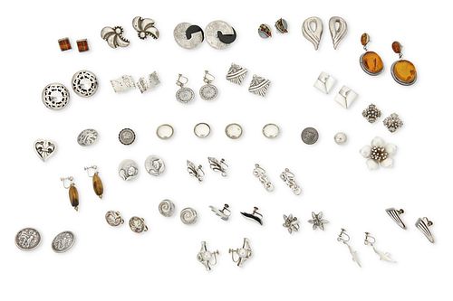 A large group of silver jewelry