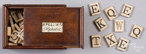 Miniature walnut slide lid bone alphabet blocks