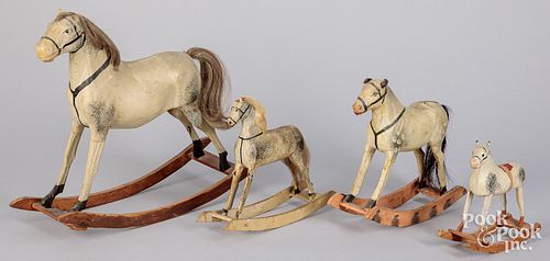 Four graduated carved rocking horse toys