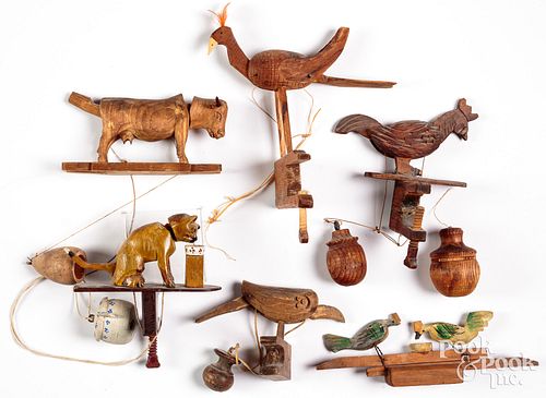 Five carved animated swing balance toys, 20th c.