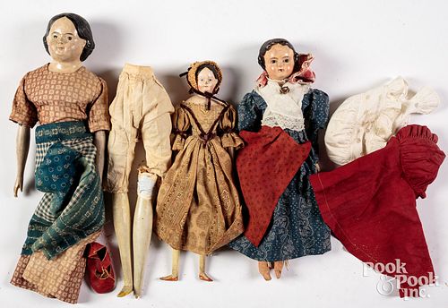 Three composition molded hair dolls, 19th c.