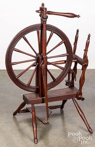 Antique spinning wheel.
