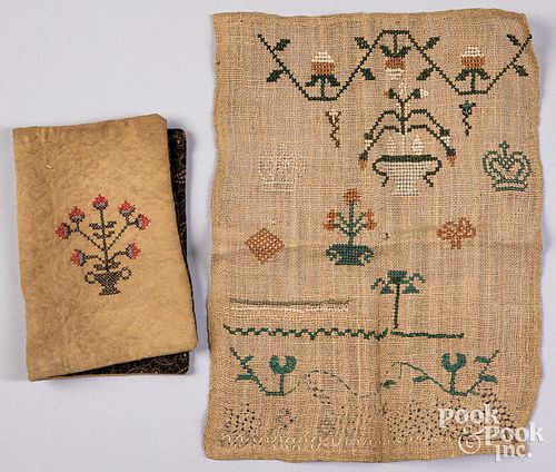 Needlework on cotton wallet and a sampler