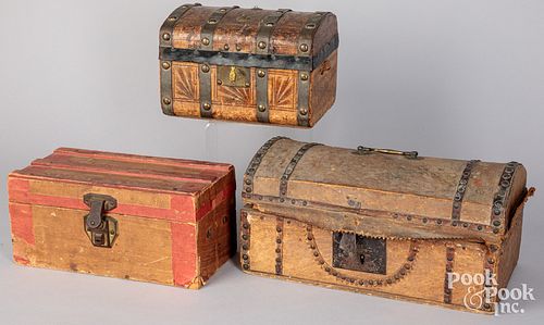Three boxes, to include two hide covered examples
