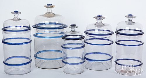 Five glass apothecary jars