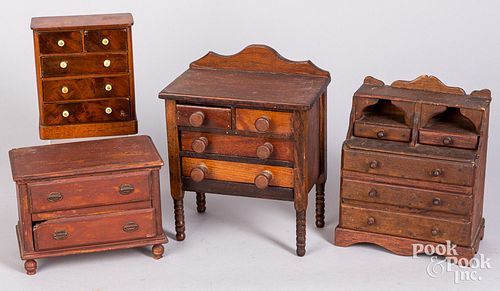 Four miniature doll chest of drawers