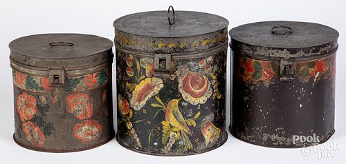 Three toleware canisters, 19th c.