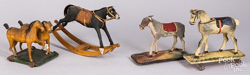 Three early platform toys and a rocking horse