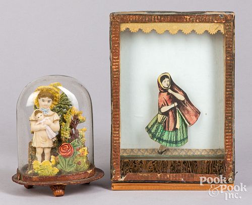 Sand toy of a dancing woman and a wax diorama