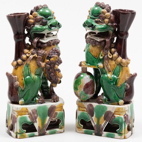 Pair of Chinese Green, Aubergine and Ochre Glazed Porcelain Buddhistic Lions