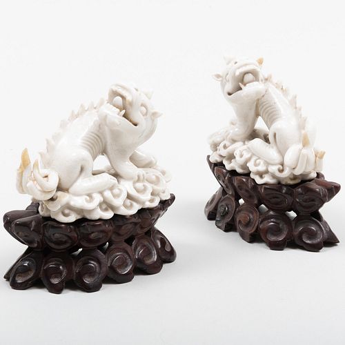 Pair of Chinese White Glazed Porcelain Mythical Beasts
