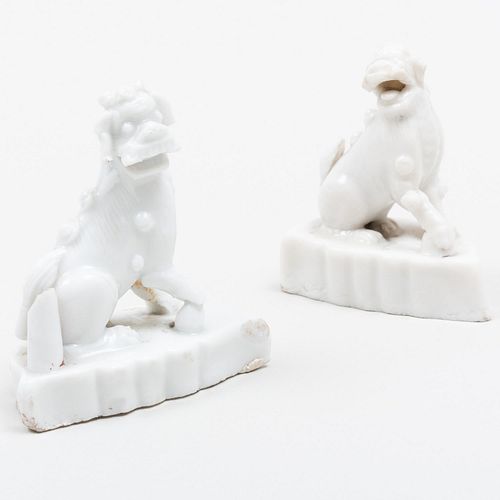 Two Miniature Chinese Porcelain Buddhistic Lions