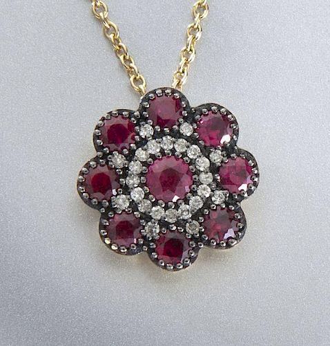 14K rose gold and ruby pendant on chain.