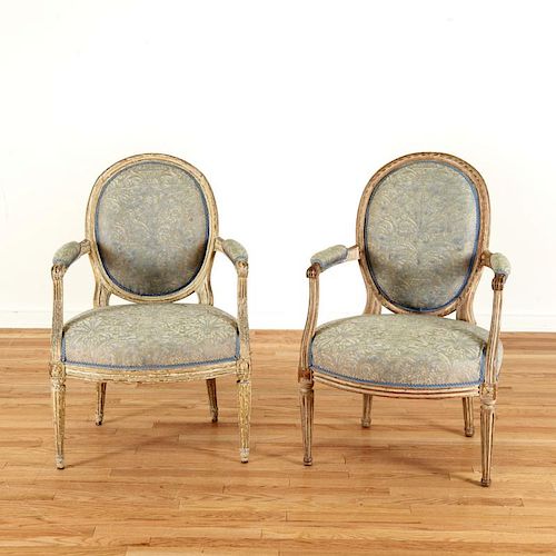 Harlequin pair Louis XVI gray painted fauteuils