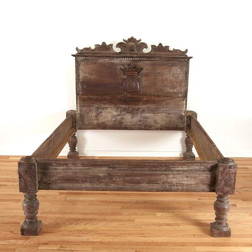 Italian Baroque carved walnut bed with crest