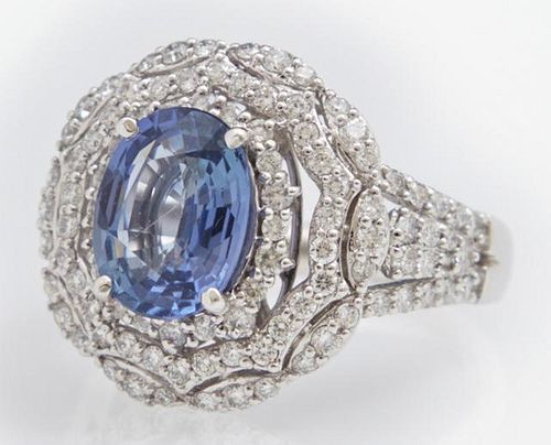 Lady's Platinum Dinner Ring, with an oval 3.29 car