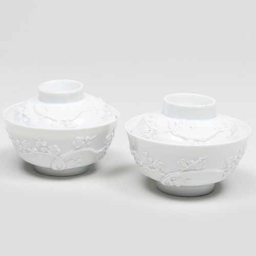 Pair Chinese of White Glazed Bowls and Covers with Molded Prunus Blossoms