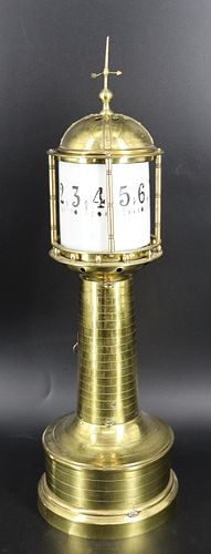 An Industrial Brass Lighthouse Clock