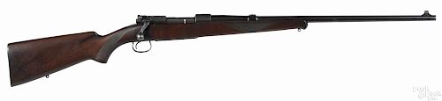 Winchester model 54 bolt action rifle, 30-06 caliber, with a checkered walnut stock