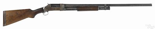 Winchester model 1897 pump action shotgun, 12 gauge, with a 30'' round barrel. Serial #900075.