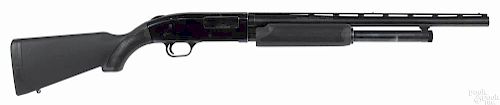 Mossberg model 500AT pump action shotgun, 12 gauge, with a ventilated rib, a black synthetic stock